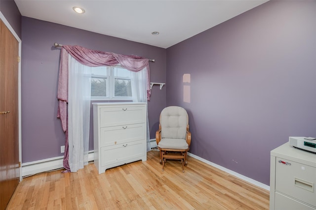 2953 Bluepoint Ct, Wantagh, NY 11793 - sitting room with light wood finished floors, recessed lighting, and baseboard heating