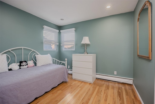 2953 Bluepoint Ct, Wantagh, NY 11793 - bedroom featuring baseboard heating, wood finished floors, and recessed lighting
