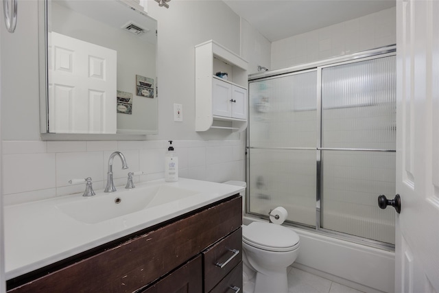 2953 Bluepoint Ct, Wantagh, NY 11793 - bathroom with vanity, shower / bath combination with glass door, tile walls, and tile patterned flooring