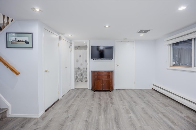 2953 Bluepoint Ct, Wantagh, NY 11793 - finished below grade area featuring stairway, wood finished floors, baseboard heating, and recessed lighting