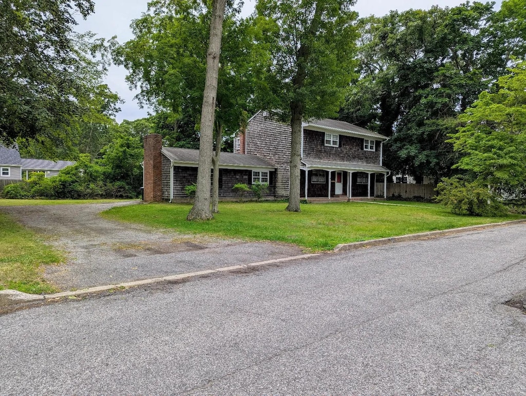 232 7th St, Saint James, NY 11780 - view of front of property with covered porch, a chimney, and driveway
