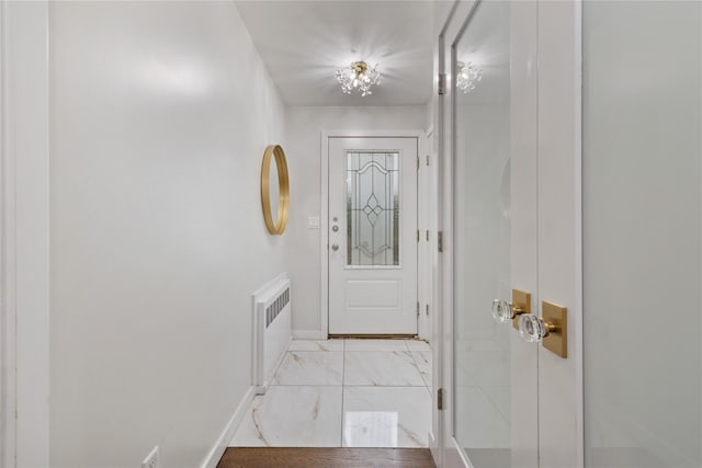 487 W Central Ave Unit 112, Spring Valley, NY 10977 - doorway with radiator heating unit and light marble finish flooring