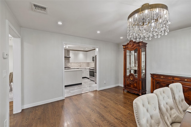 487 W Central Ave Unit 112, Spring Valley, NY 10977 - sitting room featuring recessed lighting, wood finished floors, and a chandelier