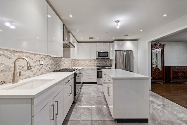 487 W Central Ave Unit 112, Spring Valley, NY 10977 - kitchen with appliances with stainless steel finishes, modern cabinets, light marble finish flooring, white cabinets, and recessed lighting