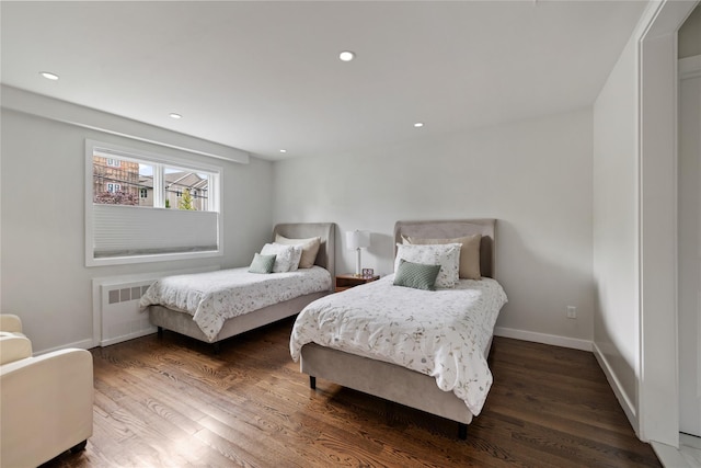 487 W Central Ave Unit 112, Spring Valley, NY 10977 - bedroom with wood finished floors, radiator, and recessed lighting