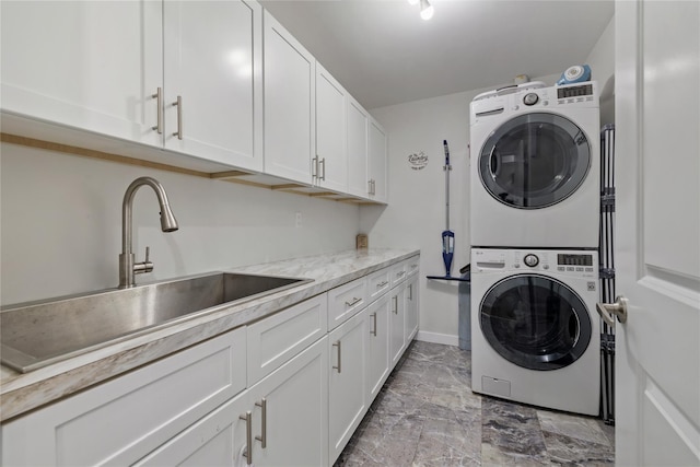 487 W Central Ave Unit 112, Spring Valley, NY 10977 - laundry room with stacked washing machine and dryer, cabinet space, and light marble finish floors