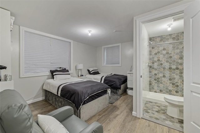 487 W Central Ave Unit 112, Spring Valley, NY 10977 - bedroom with wood finished floors and ensuite bathroom