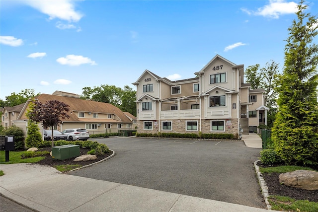 487 W Central Ave Unit 112, Spring Valley, NY 10977 - view of property featuring uncovered parking and a residential view