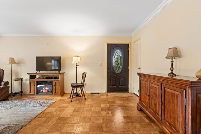 4 Devon Ct Unit B, Yorktown Heights, NY 10598 - foyer featuring ornamental molding and a glass covered fireplace