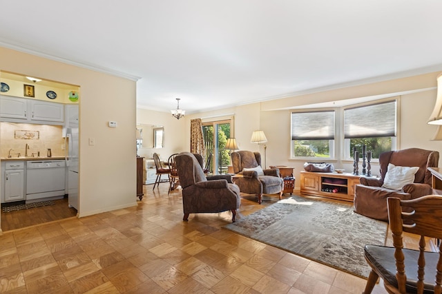 4 Devon Ct Unit B, Yorktown Heights, NY 10598 - living room featuring crown molding and a chandelier