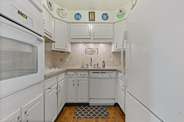 4 Devon Ct Unit B, Yorktown Heights, NY 10598 - kitchen with white appliances, white cabinetry, dark wood-style flooring, backsplash, and light countertops