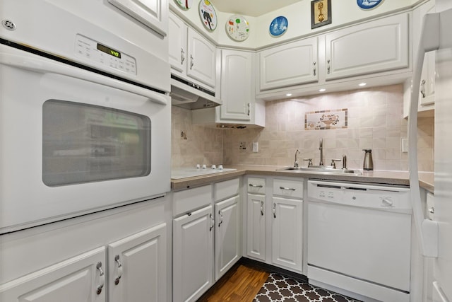 4 Devon Ct Unit B, Yorktown Heights, NY 10598 - kitchen featuring white appliances, under cabinet range hood, white cabinets, and backsplash