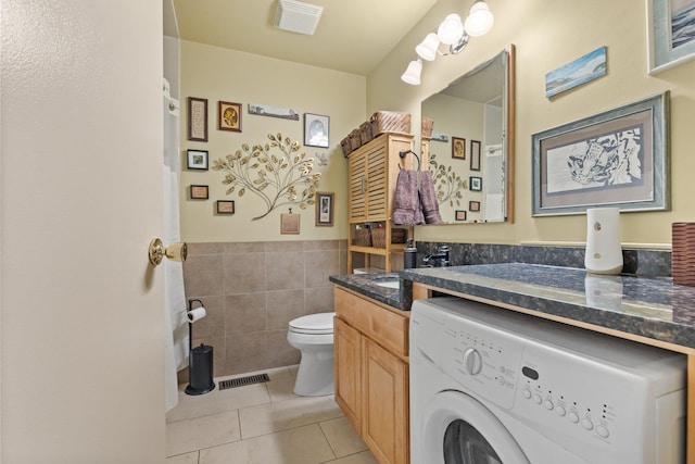4 Devon Ct Unit B, Yorktown Heights, NY 10598 - bathroom with washer / clothes dryer, tile patterned flooring, vanity, tile walls, and a wainscoted wall