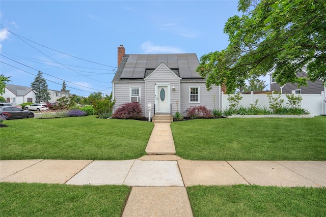 204 Leonard St, North Bellmore, NY 11710 - view of front facade with solar panels and a chimney
