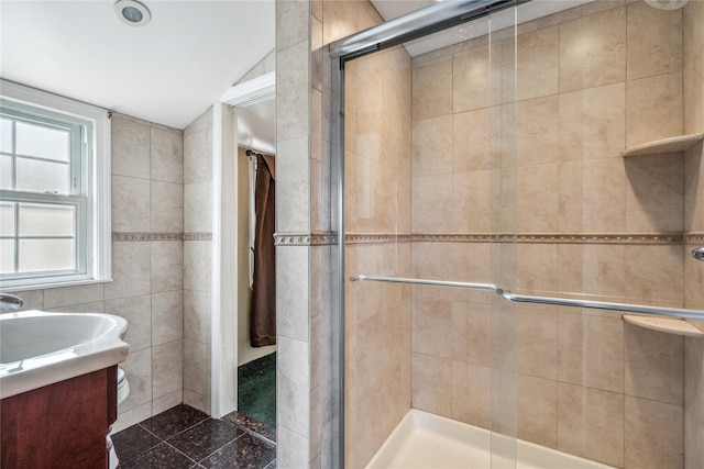 204 Leonard St, North Bellmore, NY 11710 - bathroom with a shower stall, vanity, tile walls, and lofted ceiling