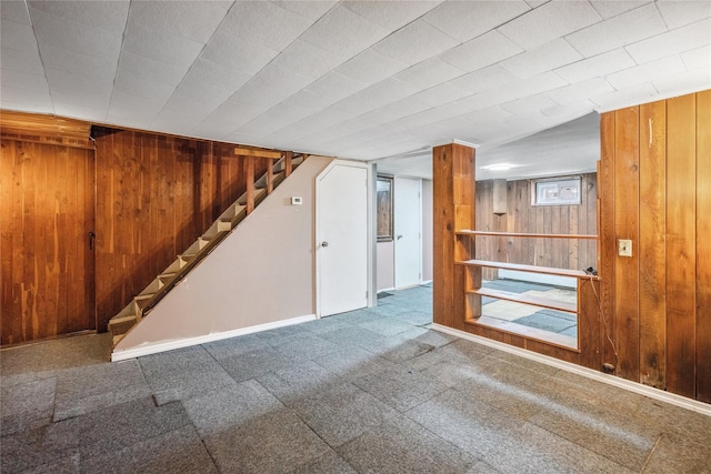 204 Leonard St, North Bellmore, NY 11710 - below grade area featuring wooden walls, stairway, and carpet flooring