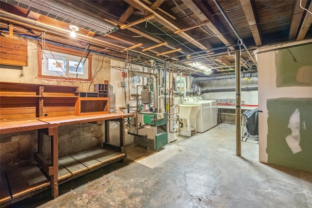 204 Leonard St, North Bellmore, NY 11710 - basement featuring washer and dryer, a workshop area, and a heating unit