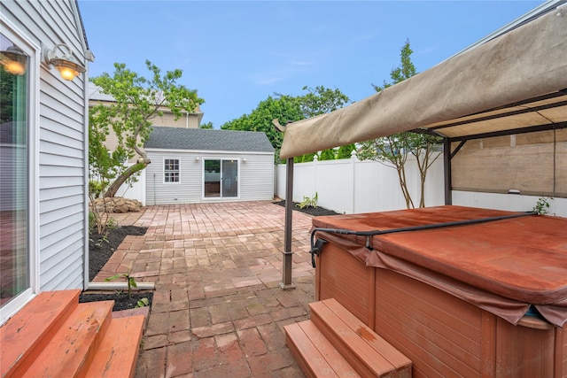 204 Leonard St, North Bellmore, NY 11710 - view of patio with a hot tub and an outdoor structure