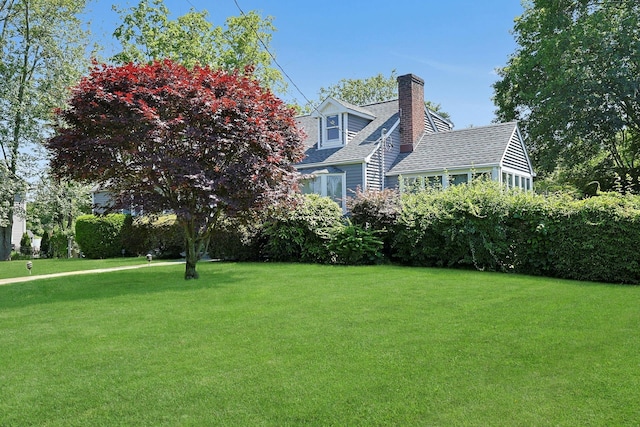 328 Willis Ave, Hawthorne, NY 10532 - view of side of home with a lawn, a chimney, and a shingled roof