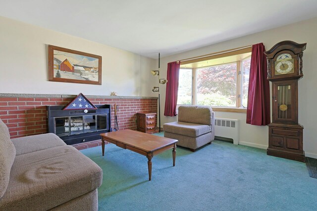 328 Willis Ave, Hawthorne, NY 10532 - carpeted living area featuring radiator and a brick fireplace