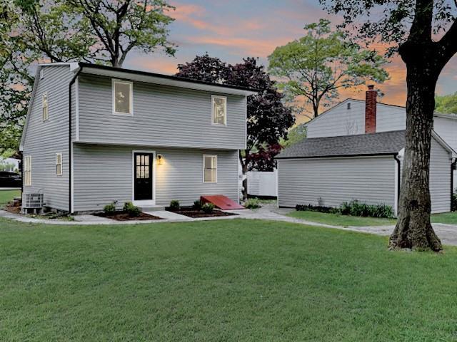 49 Heston Rd, Shirley, NY 11967 - rear view of house with a lawn