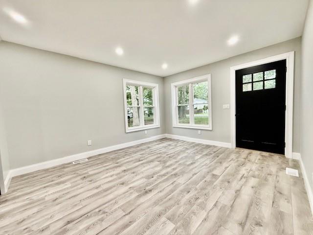 49 Heston Rd, Shirley, NY 11967 - entryway featuring light wood-style floors and recessed lighting
