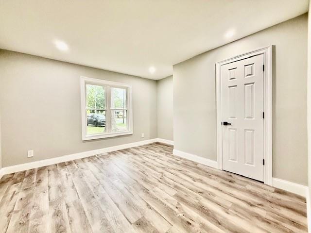49 Heston Rd, Shirley, NY 11967 - empty room with wood finished floors and recessed lighting