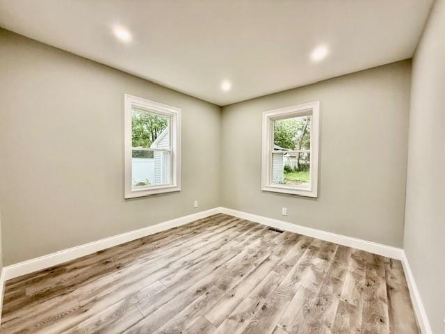 49 Heston Rd, Shirley, NY 11967 - spare room featuring healthy amount of natural light, wood finished floors, and recessed lighting