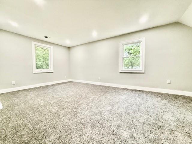 49 Heston Rd, Shirley, NY 11967 - spare room with plenty of natural light, carpet floors, and lofted ceiling