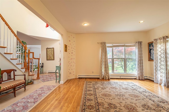 53 Vista Hill Rd, Great Neck, NY 11021 - entrance foyer featuring wood finished floors, stairway, a baseboard radiator, and recessed lighting