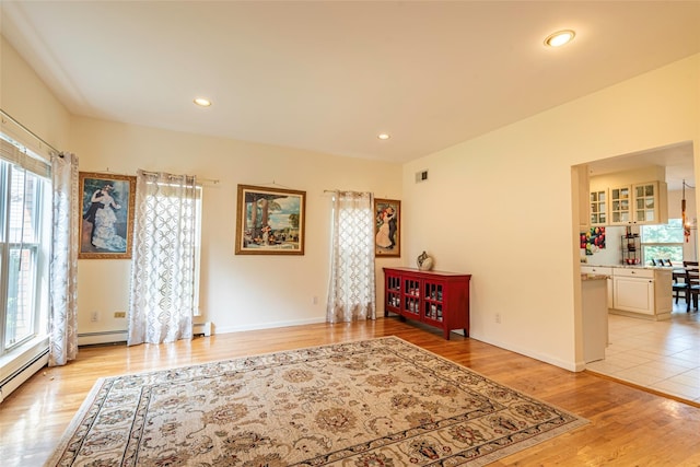 53 Vista Hill Rd, Great Neck, NY 11021 - living area with light wood-style flooring, recessed lighting, and a baseboard radiator