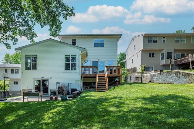 53 Vista Hill Rd, Great Neck, NY 11021 - rear view of property featuring stairs, a deck, a patio area, and a yard