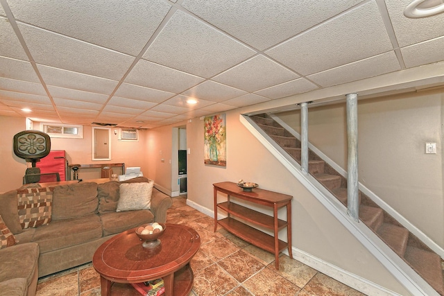 250 33rd St, Lindenhurst, NY 11757 - living area featuring stairway, electric panel, a drop ceiling, and stone finish floors