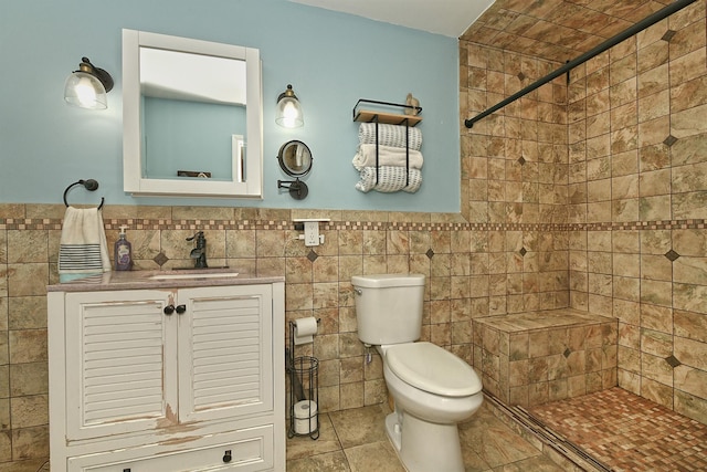 250 33rd St, Lindenhurst, NY 11757 - full bathroom with a tile shower, vanity, and tile walls