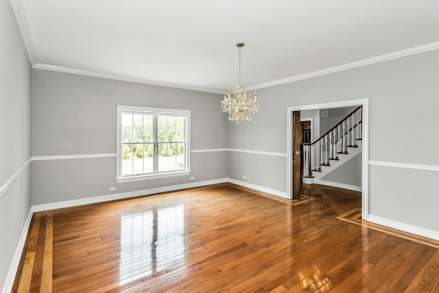 12 Orient Ave, Northport, NY 11768 - spare room featuring a chandelier, wood-type flooring, stairs, and crown molding