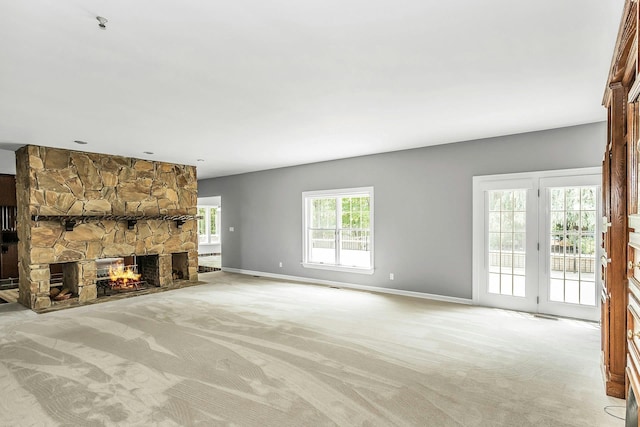 12 Orient Ave, Northport, NY 11768 - unfurnished living room with light colored carpet and a stone fireplace