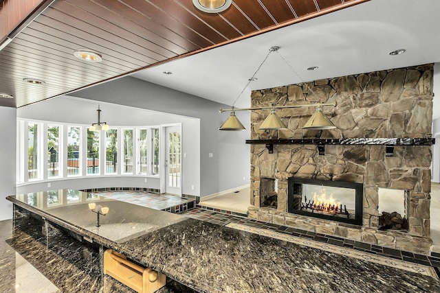 12 Orient Ave, Northport, NY 11768 - kitchen with a fireplace, recessed lighting, dark stone countertops, and wooden ceiling