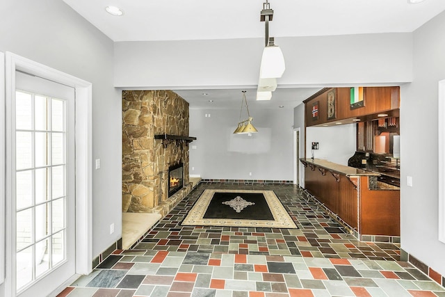 12 Orient Ave, Northport, NY 11768 - kitchen featuring a fireplace, hanging light fixtures, and recessed lighting