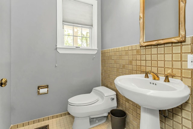 12 Orient Ave, Northport, NY 11768 - bathroom with tile walls and a wainscoted wall