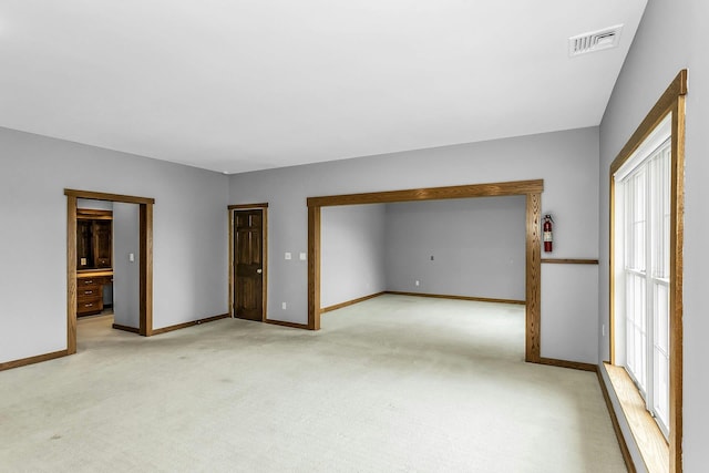 12 Orient Ave, Northport, NY 11768 - empty room with light carpet and baseboards