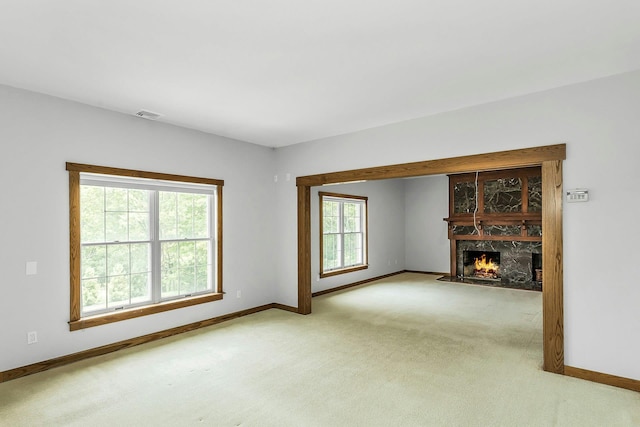 12 Orient Ave, Northport, NY 11768 - unfurnished living room with light colored carpet and a fireplace