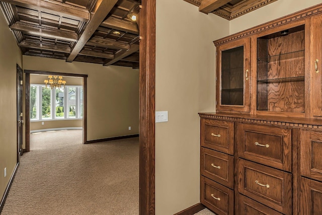 12 Orient Ave, Northport, NY 11768 - hallway featuring beamed ceiling, a chandelier, carpet flooring, and coffered ceiling