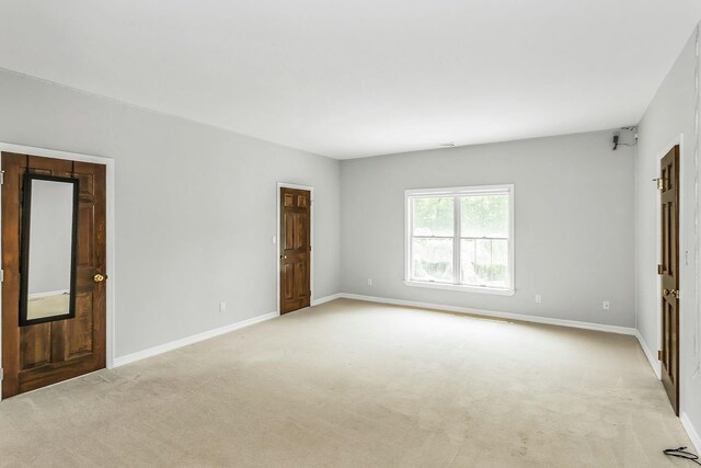 12 Orient Ave, Northport, NY 11768 - unfurnished bedroom featuring light colored carpet