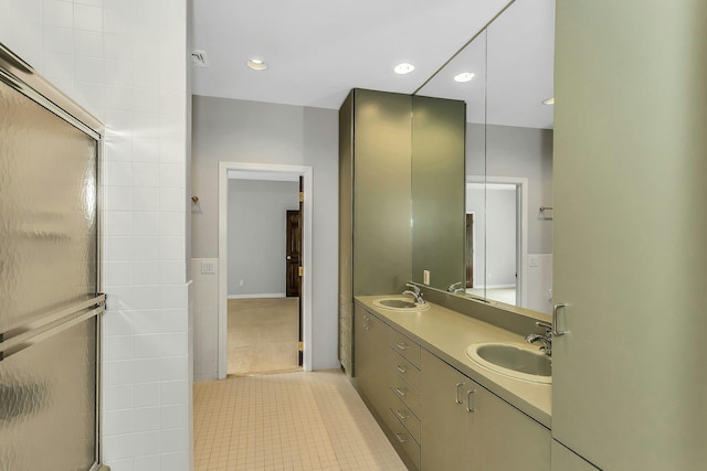12 Orient Ave, Northport, NY 11768 - full bathroom featuring double vanity, a shower with shower door, tile patterned flooring, and recessed lighting