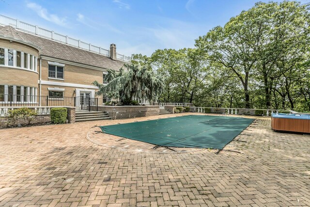 12 Orient Ave, Northport, NY 11768 - view of swimming pool with a patio, a hot tub, and french doors