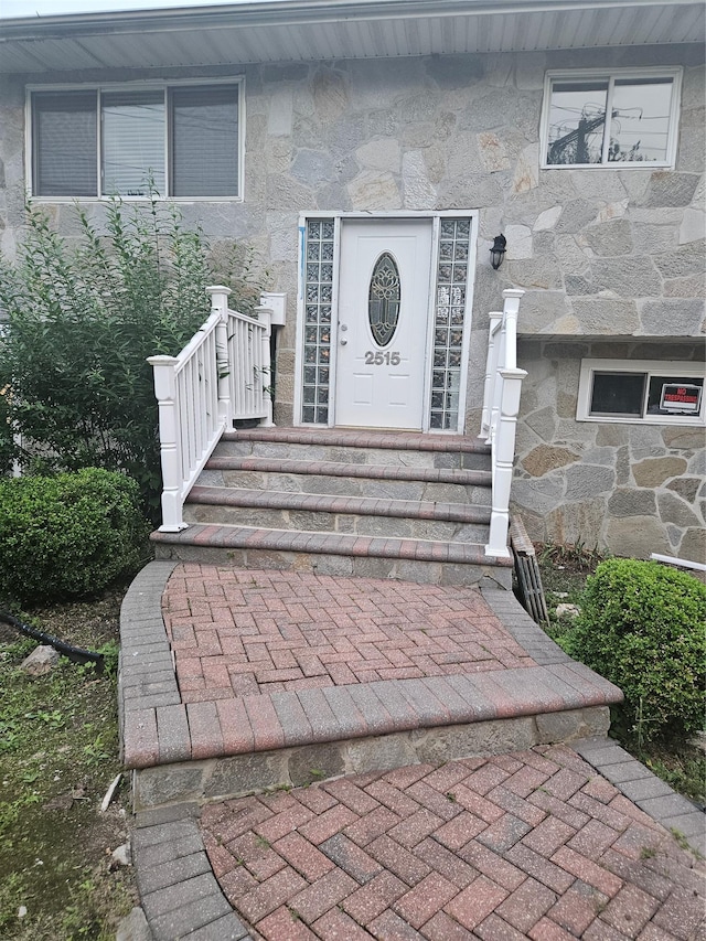 2515 S Seamans Neck Rd, Seaford, NY 11783 - doorway to property featuring stone siding