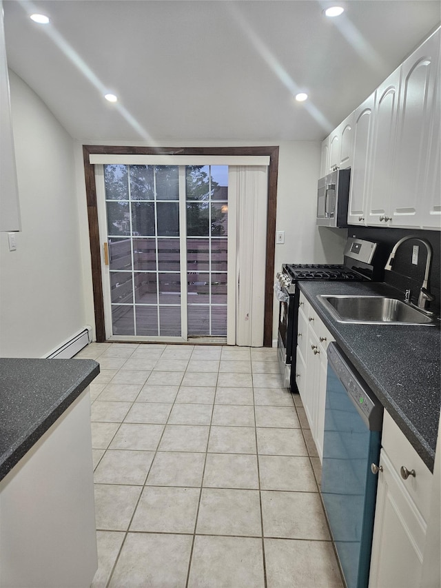 2515 S Seamans Neck Rd, Seaford, NY 11783 - kitchen featuring appliances with stainless steel finishes, white cabinetry, dark countertops, and recessed lighting