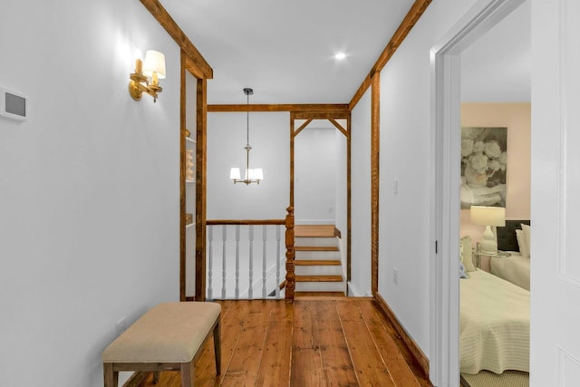 115 River Rd, Nyack, NY 10960 - hallway featuring hardwood / wood-style floors, stairs, and a chandelier