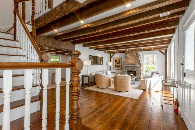 115 River Rd, Nyack, NY 10960 - living area featuring dark wood-style floors, stairs, a fireplace, and beamed ceiling