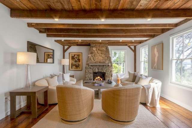 115 River Rd, Nyack, NY 10960 - living room with hardwood / wood-style floors, a stone fireplace, and a wood ceiling with exposed beams
